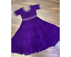 Exclusive Purple Anarkali Gown Full Flair gown 12 mtr Flair Indian Long Gown 4 frill Gown Anarkali Party wear gown Readymade purple Gown PREMIUM DESIGNER READYMADE GOWN COLLECTIONS.   GOWN   :-   FABRIC & WORK:- Faux Blooming with Beads embroidery-work SIZE:-M(38''), L(40''), XL(42''), XXL(44'') LENGTH:-56 INCH FLAIR:-12 MTR LINING:-Cotton (Full Inner Top To Bottom) SLEEVE:- Half Sleeves NECK TYPE:-Round Neck PACKAGE CONTAIN:-Gown WEIGHT:- 0.800KG 🌸 Welcome to ViaaCollectionUK! 🌸 Browse our ex Purple Ruffled Maxi Dress For Wedding, Wedding Purple Ruffled Maxi Dress, Purple Floor-length Sharara For Navratri, Purple Maxi Length Lehenga For Wedding, Purple Anarkali Dress For Eid, Purple Dress With Pallu For Navratri, Purple Gown With Pallu For Navratri, Festive Anarkali Dresses In Purple, Purple Pallu Gown For Navratri