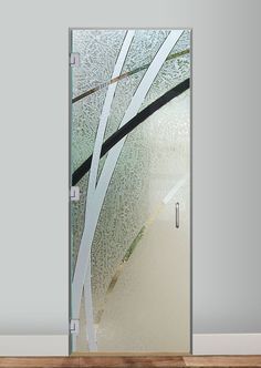 a glass door with an abstract design on the front and side panels that are frosted