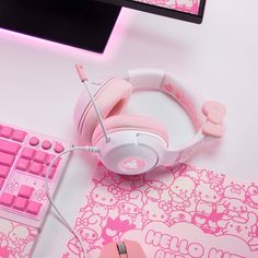 a pink hello kitty mouse, keyboard and headphones