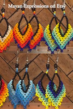 several different colored beads hanging from hooks on a wall with the words, maybe expressions of easy