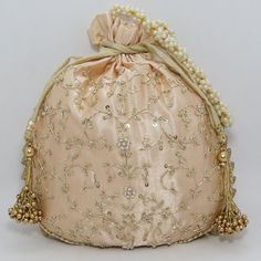 "traditional indian golden zardosi sequin embroider wedding giveaway bag potli | beautiful handmade gifting drawstring purse for woman Package Contents: 1 Size: 10\" x 8\" Designed with the heart, this beautiful Potli or batawa bag are eye catchy and made of premium material. Key Features: Zardosi embroidery art work. This potli is good match with both Indian and western outfits and are superb for wedding and festive parties. This would be best complement to your designer saree, lenhga or any ot Festive Zari Work Potli Bag For Reception, Bollywood Style Potli Bag With Dori Work For Reception, Gold Embroidered Fabric For Navratri Reception, Gold Embroidered Fabric With Gota Work For Reception, Gold Embroidered Fabric For Reception And Navratri, Gold Handwork Evening Bag For Reception, Gold Embroidered Evening Bag Gift, Gold Evening Bag With Handwork For Reception, Gold Embroidered Potli Bag For Receptions And Festivals