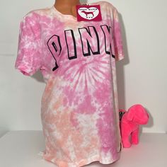 New With Tags Victoria’s Secret Pink T-Shirt Logo 100% Cotton Tie Dye Crewneck Top Size Medium No Offers Please Pink Graphic Print T-shirt For Loungewear, Pink T-shirt For Summer Loungewear, Casual Pink Short Sleeve T-shirt, Cute Pink Short Sleeve T-shirt, Cute Tie Dye Crew Neck Top, Cute Tie-dye Crew Neck Top, Spring Tie Dye T-shirt For Loungewear, Casual Pink T-shirt For Spring, Trendy Pink Short Sleeve T-shirt