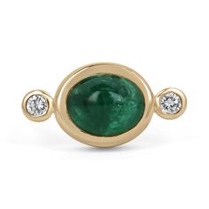 A magnificent emerald cabochon and diamond accent three-stone ring. This remarkable piece features a stunning, high-quality, dark emerald green cabochon emerald. Cut into the shape of an oval, with very good clarity and luster. The center stone is bezel set, with two brilliant round-cut diamonds accenting either side. Crafted in fabulous 14K yellow gold.  Setting Style: Bezel - Three Stone Setting Material: 14K Yellow Gold Setting Weight: 6.8 Grams Main Stone: Emerald Cut: Cabochon Shape: Oval Cut Weight: 4.36-Carats Clarity: Transparent Color: Dark Green Luster: Very Good Treatments: Natural, Oiling Origin: Zambia Secondary Stone: Diamond Weight: 0.14-Carats (Total) Cut: Brilliant Round Clarity: VS2 Color: I Luster: Very Good Treatments: Natural Estimated Retail Value: $12,590.00 USD Keep Oval Gold Diamond Cabochons, Yellow Gold Diamond Cabochons Fine Jewelry, Anniversary Diamond Cabochon, Fine Jewelry Emerald Diamond Cabochon Ring, Fine Jewelry White Gold Cabochon Emerald Ring, Fine Jewelry White Gold Emerald Cabochon Ring, White Gold Cabochon Emerald Ring Fine Jewelry, Classic Cabochon Emerald Ring, Heirloom Oval Cabochon Emerald Ring