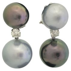 18K White Gold drop earrings featuring four two tone Tahitian pearls measuring 12-14 mm with two round brilliants weighing 0.60 carats. Pearl Quality : AA Pearl luster: AA Gold Double Earrings, Sea Inspired Earrings, Antique Diamond Jewelry, White Gold Drop Earrings, Double Earrings, Black Diamond Ring Engagement, Mismatched Earrings, Black Diamond Ring, White Gold Earrings