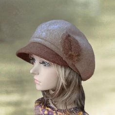 This felt wool  women's cap with visor is a very stylish. It has a small visor and decorated with 3 flowers which made of the same fabric as the cap.  It is quite soft to the touch. 100% WoolThe cap has elastic behind to insure comfy fit. The cap  fits an average size women's head. Lightweight and warm at the same time suitable for all occasions. This headpiece is a timeless classic and great for all ages. Features a visor is great for a hip, trendy look. It will  keep you warm, yet you will  lo Womens Winter Hats, Ladies Cap, Average Size Women, Wool Hats, Knitted Beret, Cotton Beanie, Womens Hat, Berets Cap, Cap Fits