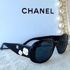 Absolutely Stunning Chanel Camellia Sunglasses That Will Add Chic Style To Any Wardrobe. Dressed Up Or Down, You Can't Go Wrong With The Luxuriousness Of Chanel. These Elegant Sunglasses Feature A High French Style And Are Beautifully Detailed With White Flowers And The Chanel Cc Logo On The Temples. Glasses Come With A Dust Bag. There Are Minor Scratches On The Lenses. Carefully Examine All Photos To Confirm The Described Condition. No Trades! No Bundle! Reasonable Offers Are Considered Via The Chanel Glasses Sunglasses, Elegant Sunglasses, Chanel Glasses, Chanel Black And White, Chanel Camellia, Sunglasses White, Chanel Accessories, Black Sunglasses, Cc Logo