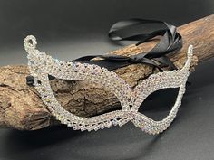 Introducing our enchanting Eye Mask, the epitome of elegance and mystery. Crafted with exquisite attention to detail, this eye-catching accessory is designed to captivate and mesmerize. Constructed from high-quality alloy metal adorned with delicate leaf-shaped rhinestones, each facet of this mask exudes sophistication and charm. Measuring approximately 7 inches by 2.3 inches (16 x 5.5cm), it offers a perfect balance of size and intricacy. Elevate your ensemble and ignite intrigue with this mask, as its graceful design adds an air of mystique to any occasion. Whether you're attending a wedding party, a masquerade ball, a costume gala, or celebrating during Mardi Gras, this mask is the ideal choice to add a touch of allure and allure to your look. With its black ribbon tie, it ensures a sec Masquerade Ball Dance, Mask Masquerade Ball, Ball Dance, Masquerade Ball Mask, Masque Halloween, Ball Mask, Party Mask, Mask Masquerade, Costume Masks