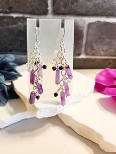 "These are handmade earrings with amethyst gemstones, silver findings and various other beads. Sterling silver earring hooks. These measure about 3\" top to bottom." Handmade Purple Sterling Silver Chandelier Earrings, Lavender Amethyst Earrings With Ear Wire, Handmade Purple Amethyst Chandelier Earrings, Adjustable Lavender Sterling Silver Earrings, Nickel-free Amethyst Dangle Earrings, Nickel Free Amethyst Dangle Earrings, Silver Dangle Beaded Earrings With Natural Stones, Lavender Nickel Free Dangle Earrings, Amethyst Dangle Earrings For Jewelry Making