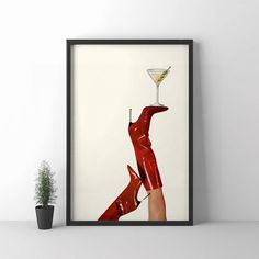 a woman's legs in high heels holding a martini glass