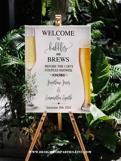 a welcome sign with two glasses of beer on it and greenery in the background