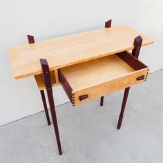 two wooden desks sitting on top of each other