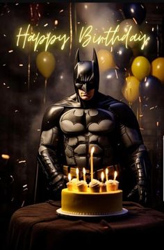 a batman birthday cake with candles on it