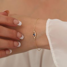 "Our 14K Solid Gold and diamond eye bracelet is suitable for daily use. It is a beautiful and meaningful gift for you and your loved ones. All of our products are 14 Carat Gold and Real Diamonds and are of very high quality and sparkle. F E A T U R E S * Made to Order. * Gold KT: 14K * Choice of Gold Color: Yellow Gold, Rose Gold, White Gold * Gem Stone: Genuine Diamond * Diamond-Cut: Round * Diamond Carat: 0.07 ct. * Sapphire Carat: 0.25 ct. * Height: 14,00 mm / 0.55 inch * Width: 7,50 mm / 0.30 inch * Diamond Color-Clarity: G.VS Color, SI Clarity * Choice of chain length: 5\", 5.5\", 6\", 6.5\", 7\" (+1\") * Setting Type: Bezel Setting * Ready to Ship in 1-3 Business Days * 100% US sourced * 2 Years Warranty * Free Express International Shipping * Free returns within 14 days from the ord Elegant Yellow Gold Evil Eye Bracelet, Elegant Gold Evil Eye Bracelet With Diamond Details, Elegant 14k Gold Evil Eye Bracelet Gift, Elegant Gold Evil Eye Bracelet With Diamond Eyes, Elegant Gold Evil Eye Bracelet With Cubic Zirconia, Elegant Evil Eye Bracelet With Diamonds As Gift, Adjustable 14k Gold Evil Eye Bracelet, Elegant Evil Eye Bracelet, Diamond Birthstone Bracelets As Gift