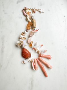 ABOUT THIS PIECE: "Just Peachy" necklace.  Handcrafted, one-of-a-kind, eco-friendly piece entailing: mother of pearl, recycled glass, shells, tiny cotton tassels, Swarovski Crystal, faceted gold pyrite, handmade ceramic + paper beads, wood, bamboo coral, seed bead and 14K gold vermeil hardware. 16" with a 2.5" extender.  Wear this statement necklace anywhere, be it a casual day with a white tee + jeans to a special occasion or on vacation.  I'm happy to custom make a necklace with the colours of Handmade Pink Necklaces For The Beach, Pink Bohemian Necklace For Wedding, Bohemian Pink Necklace For Wedding, Bohemian Pink Wedding Necklace, Handmade Summer Jewelry For Beach Wedding, Bohemian Orange Necklace For Wedding, Pink Strand Necklaces For Summer, Summer Pink Strand Necklaces, Beach Single Strand Long Necklace