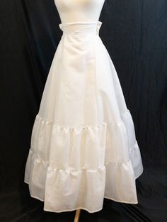 Long white petticoat with a layer of netting between the outer skirt and inner skirt.  High waisted Nylon zipper closure By; Under-Cover Torrance, California Size: 7  Measures: The current measurements are as follow, the previous owner stitched darts - 1" on each side of waist, which could be removed. Add 2" to measurements if remove darts.  27" under bust 25" waist  42" length from top of slip to hem Condition: Very good condition White Petticoat, Torrance California, Petticoat, Favorite Outfit, Beauty Book, Art Collection, High Waist, Bathing Beauties, Lingerie