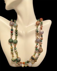 Beautiful multiple colors agate stone necklace. The necklace has agate stones of green, lavender, white, brown and rust. It hangs over the neck without a clasp. It's 35' long.  It's in a great vintage condition. Vintage Multicolor Necklaces With Natural Stones, Adjustable Multicolor Jasper Necklaces, Multicolor Jasper Spiritual Necklace, Vintage Multicolor Natural Stones Necklace, Spiritual Multicolor Jasper Necklaces, Vintage Agate Necklaces With Colorful Beads, Vintage Agate Necklace With Colorful Beads, Vintage Multicolor Agate Jewelry, Vintage Agate Necklace With Natural Stones