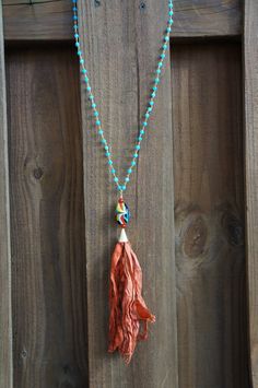 Blue Jade rosary chain, vintage marino glass bead with a silk tassel Bohemian Lariat Necklace With Tassels For Gifts, Bohemian Lariat Necklace With Tassels As Gift, Bohemian Tassel Necklace With Beaded Chain, Bohemian Tassel Necklace With Dangling Beads For Beach, Bohemian Beaded Lariat Necklace With Tassels, Bohemian Lariat Beaded Necklace With Tassels, Blue Bohemian Hand Knotted Necklaces, Blue Bohemian Hand-knotted Necklaces, Lariat Beaded Necklace With Tassels For Gift