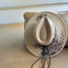 Burned Wide Brim Hat using Pyrography techniques. Each Hat is freehand Burned making it a One of a Kind. Hats made by PIPER come with a Tote/Dust bag and a crafted Macrame Wall Hat Hanger. Pyrography Techniques, Burned Hats, Hat Burning, Wall Hats, Hat Hanger, Painted Hats, Boho Hat, Velvet Hat, Flower Hats