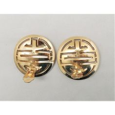 pair of gold toned cufflinks with interlocked design on each end, in the shape of a circle