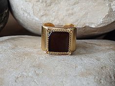 Dark Brown Adjustable Ring. Brown Square Signet Ring. Brown Enamel Ring. Women's Signet Ring. Gold Plated Enamel Ring. Gold Signet Ring. 24K Gold plated brown signet ring, beautiful and unique ring for women. One of a kind signet ring.Size: 5-8 USMetal: 24K Gold PlatedMaterials: EnamelWidth of band is 1.4 cm (0.55 Inches)Please allow 4-5 days to prepare. I usually ship earlier than this.If you are in a rush, please let me know.The ring will be packed in a gift box.FOR TURQUOISE COLOR:https://www Handmade Brown Rings For Formal Occasions, Formal Handmade Brown Rings, Formal Brown Handmade Rings, Signet Ring Gold, Onyx Signet Ring, Orange Ring, Brown Rings, Pineapple Necklace, Ear Crawler Earrings