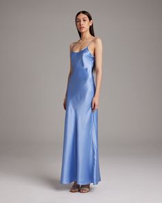 Named by Vogue as a must-have, this easy to wear luxury charmeuse slip dress is the perfect day to night staple. Featuring a bias cut and the finest silk quality, it shapes flatteringly to every type of body. Bias cut silk charmeuse slip elegantly drapes on the body. 100% Silk Charmeuse Made in New York City Model is wearing a size S and is 5'10" Product Care: Dry Clean Only City Model, Wool Wrap, The Perfect Day, Silk Slip Dress, Boatneck Sweater, Silk Tank, Silk Charmeuse, Silk Slip, Day To Night