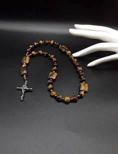 Spiritual Cross Necklace With Polished Beads, Spiritual Brown Crucifix Necklace, Brown Crucifix Necklace In Spiritual Style, Adjustable Spiritual Cross Necklace, Adjustable Spiritual Crucifix Cross Necklace, Spiritual Brown Cross Necklace, Spiritual Hand-strung Cross Jewelry, Spiritual Crucifix Necklace With 8mm Beads, 108 Bead Cross Jewelry For Meditation