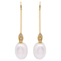 Yellow Gold and Pearl Earrings for women 6x Brilliant cut Diamonds with total weight 0.06cts., G/Vs quality and 2x 12.5mm oval pearls Without closure 18 kt Yellow Gold. 6.40 grams. Measurements: 4cm long Brand new product Ref: D360904FV Oval Diamond Earrings With Elegant Design For Formal Occasions, Elegant Oval Diamond Earrings For Formal Occasions, Luxury Oval Pearl Drop Earrings, Yellow Gold Oval Pearl Earrings, Elegant Oval Hallmarked Earrings, Formal Oval Yellow Gold Pearl Earrings, Oval Yellow Gold Pearl Earrings Fine Jewelry, Formal Oval Earrings With Pearl Drop, Luxury Oval Pearl Earrings For Formal Occasions