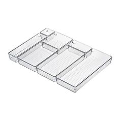 three clear plastic trays with dividers on each side, one holding four compartments