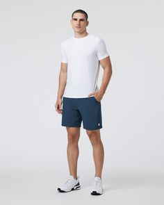 One short for every sport, the Kore Shorts have a classic athletic fit, falling just above the knee with an anywhere and everywhere versatility. Go commando in confidence with the breathable, boxer-brief liner.Also available in 5" and 9" inseam. | Vuori Kore Shorts | Indigo | XXL Vuori makes premium performance apparel inspired by the active Coastal California lifestyle; an integration of fitness, surf, sport, and art. Breaking down the boundaries of traditional activewear, we are a new perspect Cotton Boxer Briefs With Built-in Shorts For Sports, Athleisure Cotton Swim Trunks In Short Length, Athleisure Cotton Swim Trunks, Cotton Athleisure Swim Trunks, Moisture-wicking Short Boxer Briefs For Running, Athleisure Boxer Briefs With Built-in Shorts For Running, Sporty Cotton Boxer Briefs For Workout, White Boxer Briefs With Built-in Shorts For Sports, White Boxer Briefs With Built-in Shorts For Gym