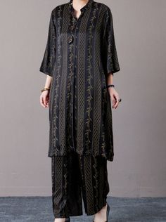 Elevate your wardrobe with our Elegant Black and Gold Embroidered Long Shirt and Wide-Leg Pants Set. This sophisticated ensemble features a long shirt adorned with intricate gold embroidery, offering a touch of luxury and elegance. The matching wide-leg pants provide a comfortable yet stylish fit, perfect for both formal and casual occasions. Made from high-quality fabric, this set ensures you look effortlessly chic and poised. Pair with your favorite accessories to complete the look. Key Features: Black long shirt with luxurious gold embroidery Matching wide-leg pants for a comfortable fit High-quality fabric for a chic appearance Perfect for both formal and casual events Versatile design for various styling options Black Set With Gold Embroidery For Eid, Black Long Sleeve Sets With Gold Embroidery, Gold Long Sleeve Sets With Floral Embroidery, Gold Floral Embroidery Long Sleeve Sets, Black Embroidered Workwear Sets, Black And Gold Outfit, Versatile Clothing, Gold Outfit, Versatile Outfits