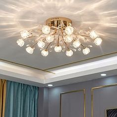 a chandelier hanging from the ceiling in a room