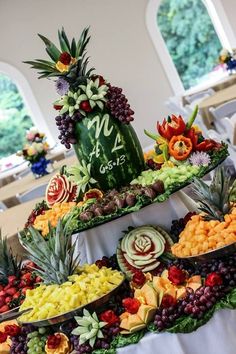 a table topped with lots of different types of fruits and veggies on top of it