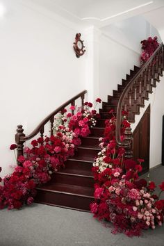 a staircase with flowers on the steps