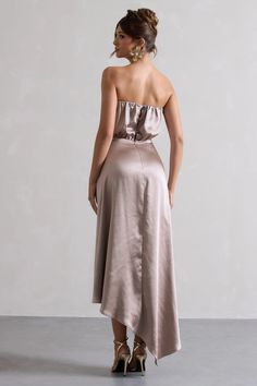 A maxi to see you through every occasion, Willa will have you reaching for it in your wardrobe time after time. Designed in a premium luxurious taupe satin that is beautifully flowing, Willa boasts a cinched in waist and artful asymmetric hemline. Style this strapless maxi with a sleek bun to show off its flattering neckline and some strappy stilettos to turn heads at your next event.  Features  - Premium satin - Bandeau neckline  - Strapless - Keyhole button closure - Invisible zip closure  - Asymmetric hemline  - Maxi length   Sizing & Fit  Model is 5'7 and wears UK size 8 / US size 4  Product Information     Unlined with some stretch Premium satin in Taupe (95% Polyester, 5% Elastane)  140cm total length  SKU: CL132320097 Bandeau Maxi Dress, Velvet Prom Dress, Sleek Bun, Time After Time, Black Dress Prom, Strappy Stilettos, Black Tie Gala, Party Dress Long Sleeve, Strapless Maxi