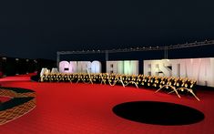 a red carpeted area with chairs and letters