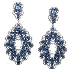 Introducing our dazzling celestial creations: Diamond Sapphire 18K White Gold Chandelier Earrings! These earrings aren't just accessories; they're wearable constellations that will make you the star of any event. Picture this: 6.94 carats of round diamonds, each sparkling like a tiny piece of stardust, suspended from the heavens. These diamonds not only catch the light but also hold it captive, creating a cosmic dance of brilliance with every movement. But the real magic lies in the 62.56 carats Rose Gold Chandelier, Rose Gold Chandelier Earrings, Cosmic Dance, Dance Earrings, Diamond Chandelier Earrings, Diamond Chandelier, Silver Chandelier Earrings, Gold Chandelier Earrings, Silver Chandelier