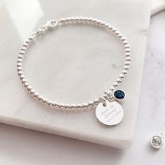 Combining our Engraved Jewellery & our Birthstone Charm to make a perfectly personalised bracelet you'll love! This beautiful silver bracelet combines our silver disc charm, perfect for engraving a name or special date, with our sparkling Swarovski birthstone charm. Unsure as to what your stone is? Use our handy graphic to find out & whilst your there find out your besties, mums & little ones too! The sterling silver disc charm measures 12mm across the front of the heart and sits centrally on a Sterling Silver Round Bracelet With Birthstone, Silver Sterling Silver Charm Bracelet With Birthstone, Sterling Silver Jubilee Bracelet As Personalized Gift, Sterling Silver Jubilee Bracelet For Personalized Gift, Silver Name Bracelet With Birthstone, Personalized Silver Charm Bracelet With Birthstone, Engraved Sterling Silver Beaded Bracelet As Gift, Engraved Sterling Silver Beaded Bracelets As Gift, Customizable Silver Charm Bracelet