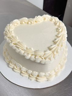 a heart shaped cake sitting on top of a white plate