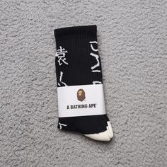 A Bathing Ape Crew Socks Japanese Writing Mens Womens Unisex Size: One Size Fits All Color: Black Off White (White Heel & Toe) Brand New In Packaging. Fast Shipping! 1 Day Shipping And Handling. Black Socks For Streetwear In Winter, Black Socks For Winter Streetwear, Winter Streetwear Socks, Black Breathable Socks For Streetwear, Breathable Streetwear Socks, Black Socks For Streetwear, Black Breathable Winter Socks, Comfortable Breathable Streetwear Socks, Comfortable Breathable Socks For Streetwear