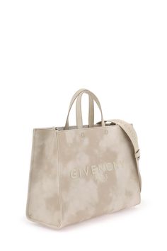 Givenchy G-Tote bag crafted from tie-dye cotton canvas with contrasting embroidered lettering logo. Leather handles, lined interior with one open pocket, detachable shoulder strap and silver-finished metalware. Givenchy Tote Bag, First Perfume, Givenchy Bag, Craft Tote Bag, Givenchy Paris, Tie Dye Cotton, Womens Business Casual, Lettering Logo, Givenchy Women