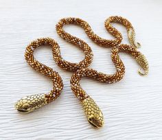 Gold snake jewelry set, Beaded gold snake necklace, Gold seed bead necklace, Wiccan jewelry, 30th bi Gold Jewelry Spacer Beads For Crafting, Beaded Snake Chain Jewelry For Gifts, Beaded Snake Chain Jewelry Gift, Handmade Snake-shaped Bohemian Jewelry, Handmade Bohemian Snake-shaped Jewelry, Handmade Bohemian Snake Jewelry, Handmade Snake-shaped Beaded Necklace For Gift, Handmade Snake Shape Necklace For Gift, Handmade Snake Shape Necklace Gift