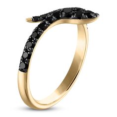 a gold ring with black diamonds on it