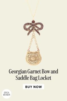 This unusual and very lovely Georgian features a repoussé locket in the shape of a saddle bag suspended from a burgundy-hued flat cut garnet bow. Hangs from a new 18" 14k gold chain. Makes a great jewelry gift for this Christmas! Gold Eyes, Saddle Bag