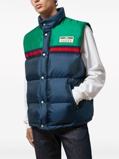 Padded vest by GUCCI in blue and green characterized by logo patch, sleeveless, button closure and drawstring waist. This item is in size 48 and the color is Blue Gucci Cotton Outerwear, Gucci Outerwear With Pockets For Streetwear, Blue Cotton Gucci Outerwear, Gucci Sporty Streetwear Outerwear, Gucci Sporty Outerwear For Streetwear, Sporty Gucci Outerwear For Streetwear, Gucci Cotton Outerwear With Pockets, Gucci Casual Cotton Outerwear, Casual Gucci Cotton Outerwear