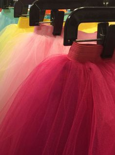 This traditional, knee length, tutu is made with 4 layers of soft tulle attached to matching color, two-inch wide elastic in two doubled rows. Child Sizes - Pre-school (4/6), Elementary (7/10). Both child sizes are 20” long. On average, the largest children’s size fits up to age 9. Larger/taller children should wear the adult sizes. Adult Sizes - XS/SA (Waist 23” - 26.5”), MA/LA (Waist 27” - 31”). All adult sizes are 25” length. Allow 3-6 weeks for delivery, depending on time of year and quantit Spring Tiered Tulle Tutu Dress, Spring Dance Tutu Dress With Stretch, Spring Tutu Dance Dress, Summer Dance Tulle Petticoat, Pink Stretch Tulle Petticoat, Red Tulle Tutu Dress For Spring, Spring Red Tulle Tutu Dress, Multicolor Tulle Skirt For Summer, Summer Stretch Tulle Tutu Dress