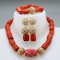 a necklace and earring set with red beads