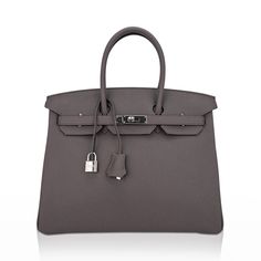 Guaranteed authentic Hermes Birkin 35 bag featured in Etain - the most perfect medium gray and is utterly neutral. Fresh with palladium hardware. Hermes leather in rich Clemence is textured and highly scratch resistant.This beautiful gray Birkin bag is a classic addition to any Hermes handbag collection.Comes with sleepers, clochette, raincoat, lock, keys and signature Hermes box.NEW or NEVER WORNMightychic offers a seamless experience for Hermes Birkin online shopping and your Hermes purchase. final sale BAG MEASURES:LENGTH 35 cm / 14"TALL 25 cm / 10"DEEP 18 cm / 7" HANDLES:TALL 5" CONDITION: NEW or NEVER WORN Hermes Leather, Hermes Birkin 35, Handbag Collection, Hermes Box, Hermes Handbags, Hermes Birkin, Birkin Bag, Bag Sale, Final Sale