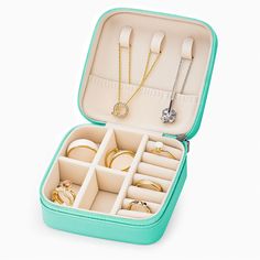 an open suitcase with jewelry inside on a white background