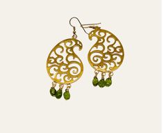 "Carved 18K gold plated paisley earrings with clear natural peridot beads. The paisley pattern is delicately carved in an open lattice style, embellished with bright clear gemstones. The earrings are  a contemporary take  on an ancient motif, the paisley. They are bold and feminine. The perfect accessory to enhance your look on a night out. The paisley motif has travelled from East to West capturing the imagination of many artisans, architects, and fashion designers. It first sprang up in Ancient Babylonia, present day Iran and Iraq. It adorned the robes of royalty as well as tiles, metals, glass, stucco, and carpets. In the 18th century it found its way to the town of Paisley in Scotland, hence the name. For me it is deeply personal and symbolic of my heritage. I am working on an entire c Green Intricate Design Gold-plated Earrings, Green Gold-plated Earrings With Intricate Design, Peridot Dangle Earrings In Gold, Gold Teardrop Peridot Earrings, Ancient Babylonia, Clear Gemstones, Paisley Earrings, Paisley Motif, All Gems