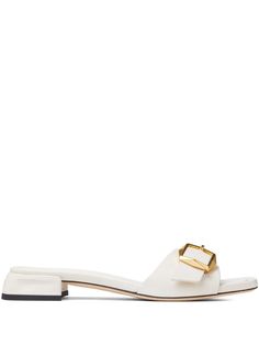 off-white leather decorative buckle detail slip-on style open toe flat leather sole gold-tone hardware Spring Slides With Gold Buckle And Open Toe, Spring Open Toe Slides With Gold Buckle, Open Toe Slides With Gold Buckle For Spring, Elegant Flat Slides For Formal Occasions, Elegant Formal Flat Slides, Elegant Mules With Buckle Closure In Slide Style, Elegant Slide Mules With Buckle Closure, Elegant Gold Flat Slides, White Leather Sandals With Rectangular Buckle